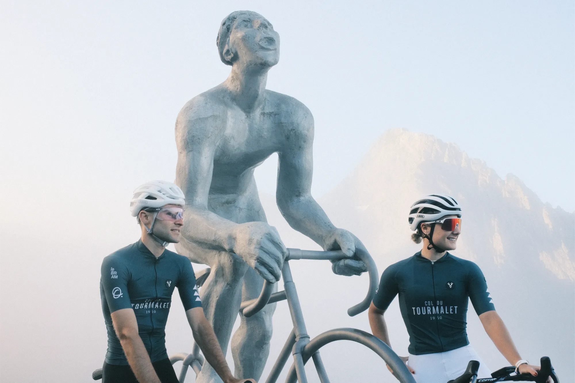 Cyclists in front of the Giant statue • Le Bram and Octave Tourmalet